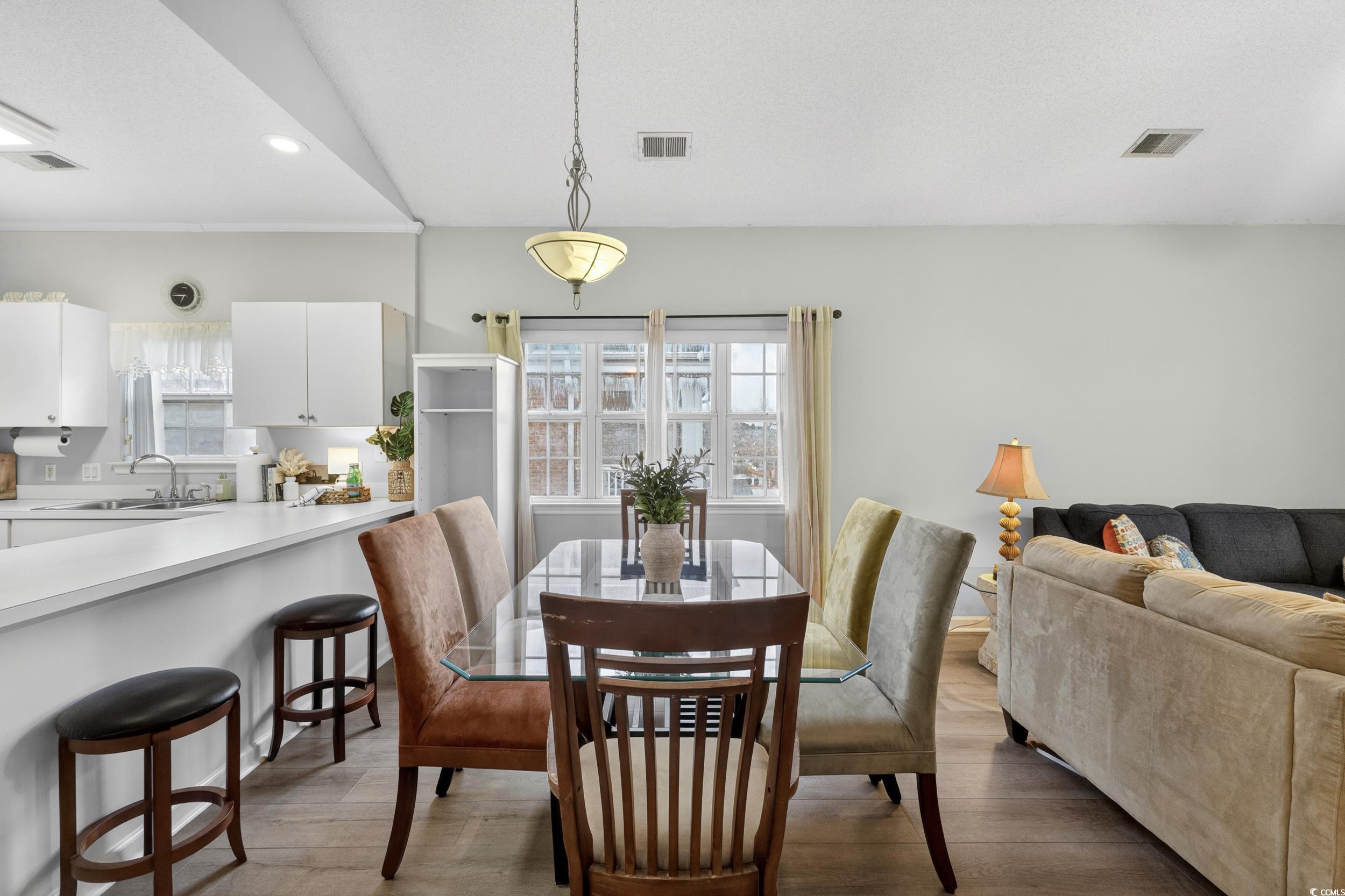 3915 Gladiola Court, Unit 301 Myrtle Beach, SC 29588 - Photo 13 of 24 Dining room featuring light wood-style flooring