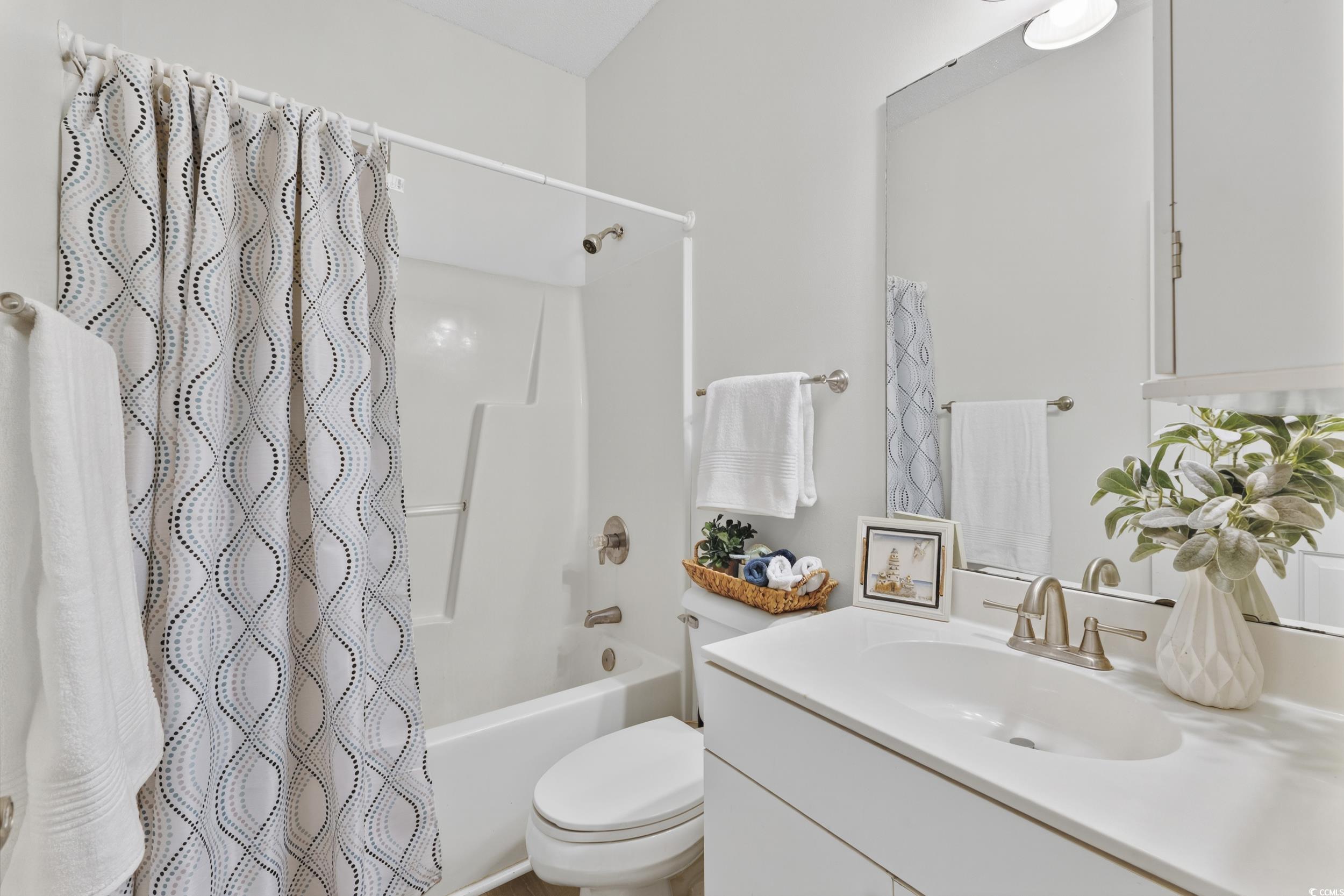 3915 Gladiola Court, Unit 301 Myrtle Beach, SC 29588 - Photo 15 of 24 Bathroom featuring shower / bath combo and vanity