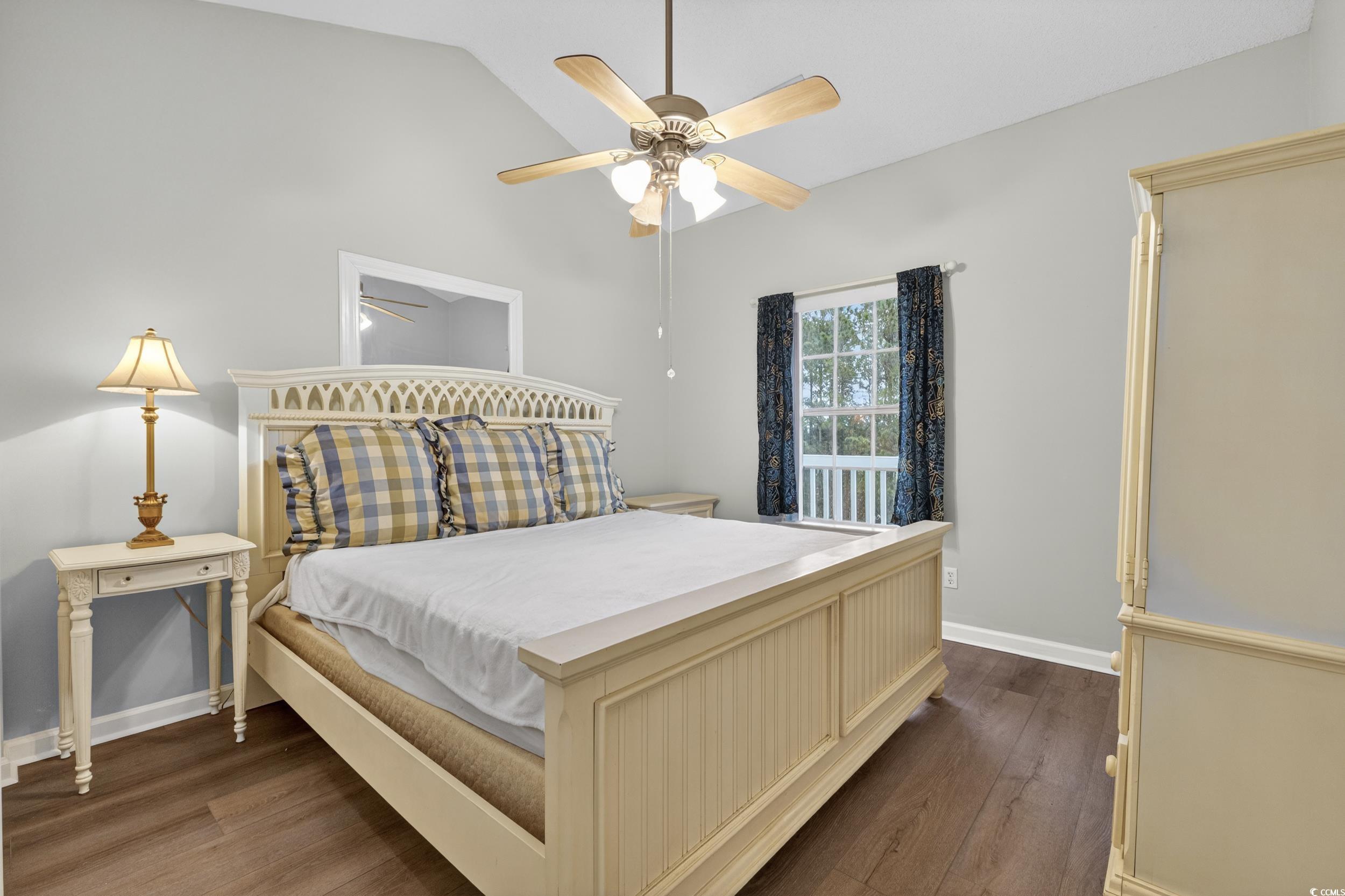 3915 Gladiola Court, Unit 301 Myrtle Beach, SC 29588 - Photo 16 of 24 Bedroom featuring dark wood finished floors, lofted ceiling, and ceiling fan