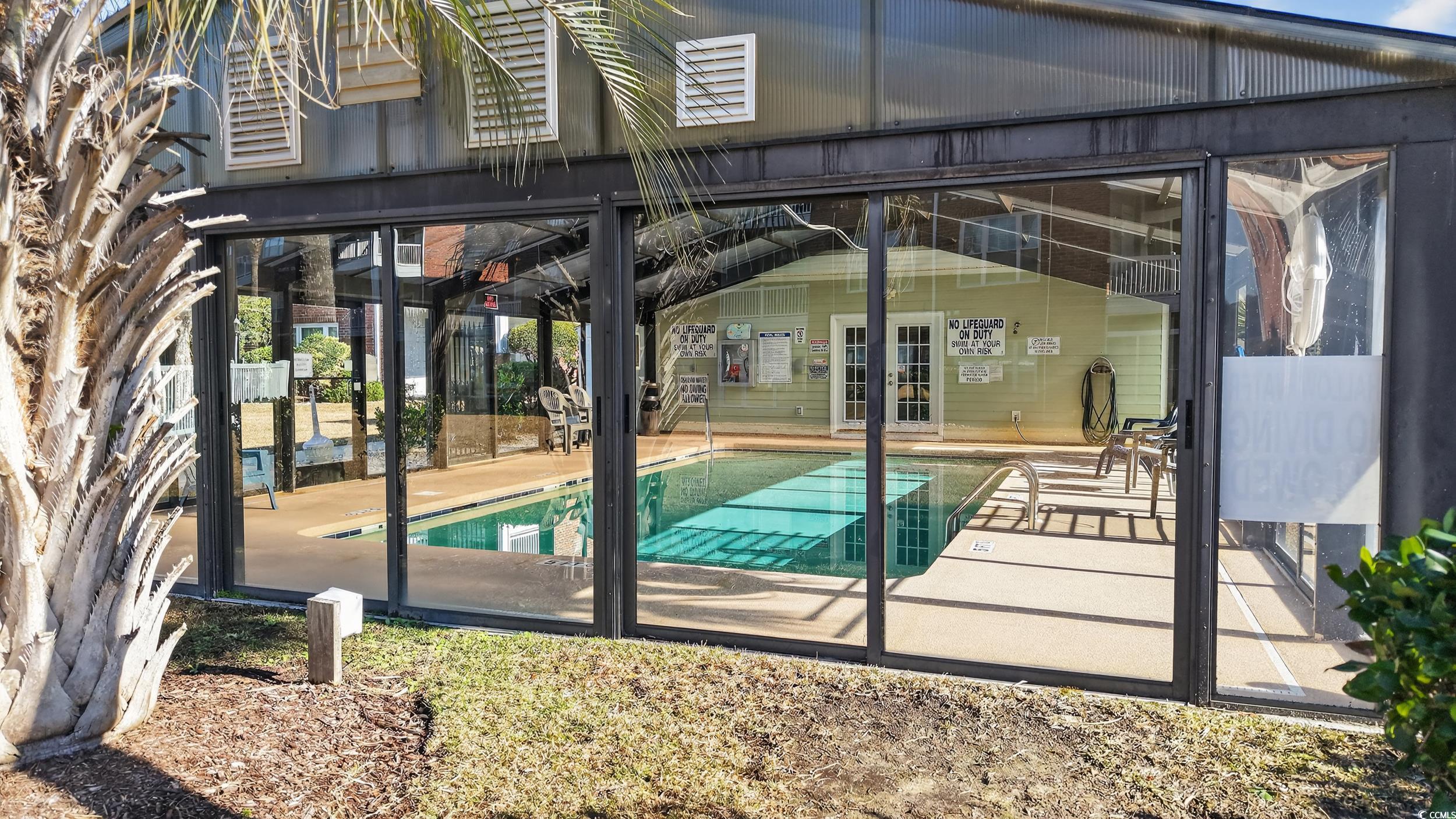 3915 Gladiola Court, Unit 301 Myrtle Beach, SC 29588 - Photo 23 of 24 Community pool with a patio and a lanai