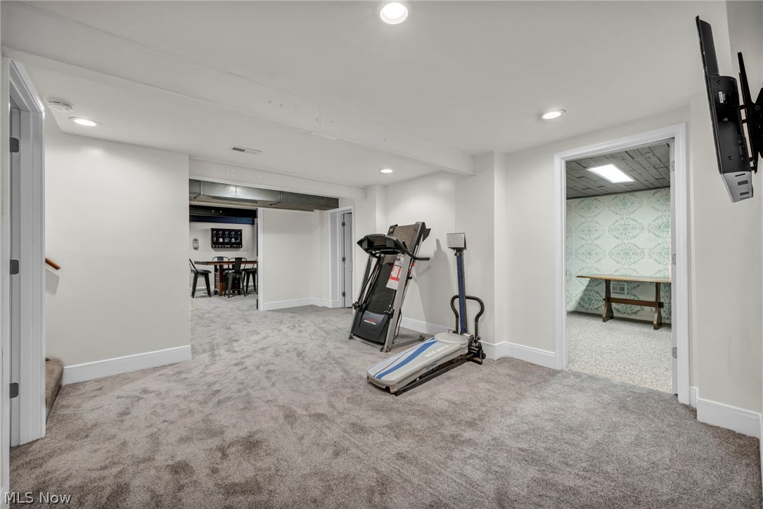 9753 Prospect Road Strongsville, OH 44149 - Photo 28 of 39 Workout area featuring carpet flooring, wallpapered walls, an accent wall, and recessed lighting