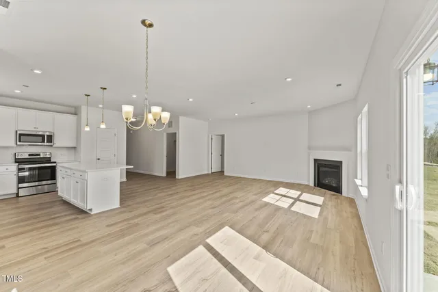 a view of a kitchen with furniture and a fireplace