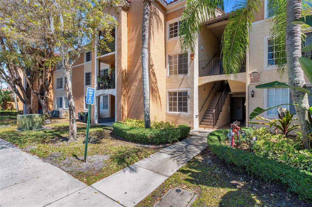 2133 Renaissance Boulevard, Unit 205 Miramar, FL 33025 - Photo 20 of 24 a view of a garden with pathway