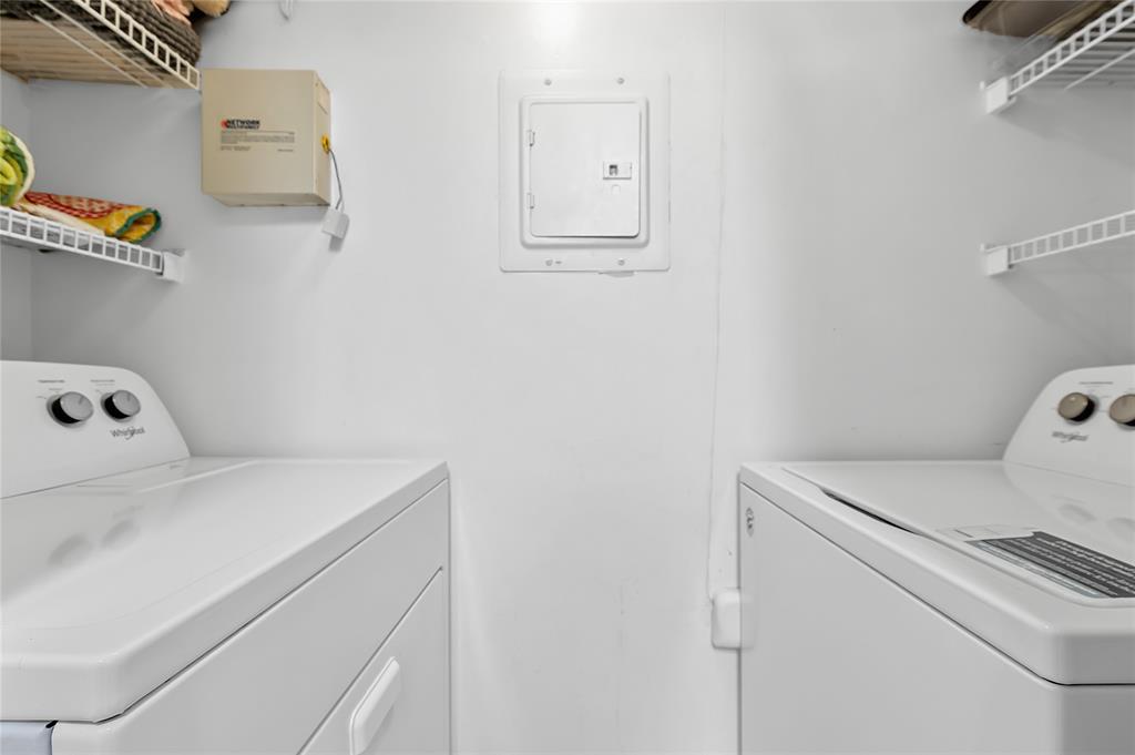 2133 Renaissance Boulevard, Unit 205 Miramar, FL 33025 - Photo 8 of 24 a utility room with dryer and washer