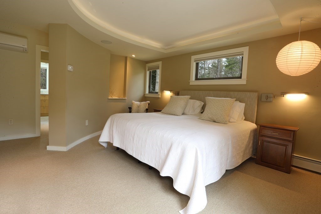 18 Willow Road Harvard, MA 01451 - Photo 12 of 35 a bedroom with a bed and a lamp