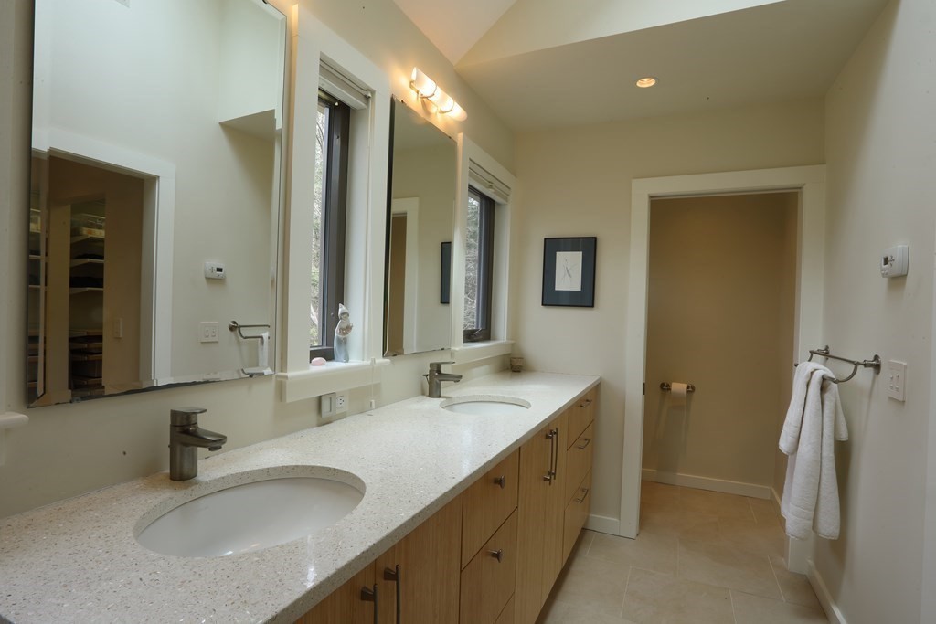 18 Willow Road Harvard, MA 01451 - Photo 15 of 35 a bathroom with double vanity sink and a mirror