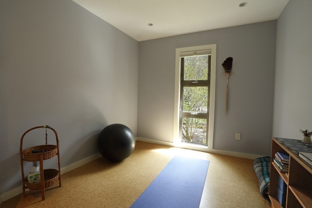 18 Willow Road Harvard, MA 01451 - Photo 21 of 35 a view of an empty room with a window and wooden floor