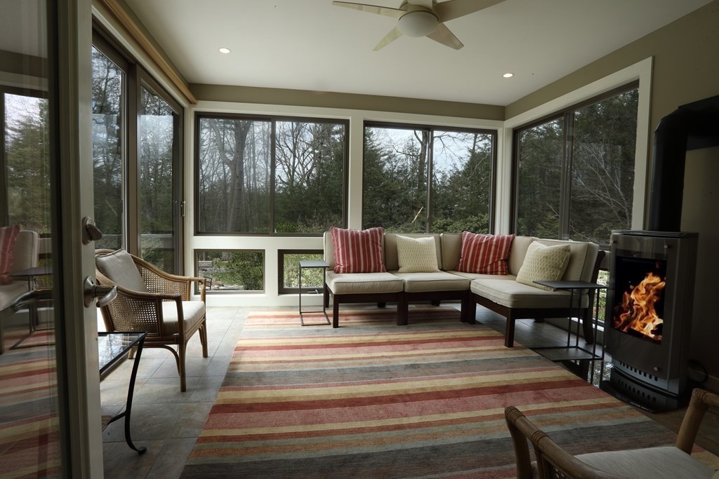 18 Willow Road Harvard, MA 01451 - Photo 25 of 35 a living room with furniture and a floor to ceiling window