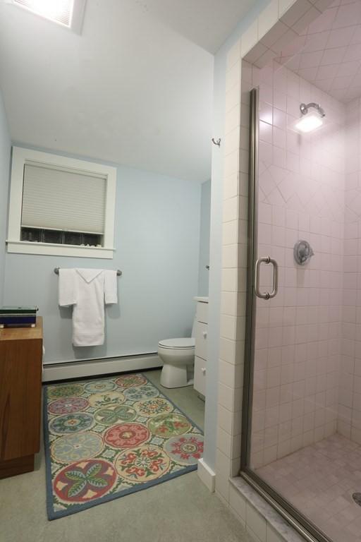18 Willow Road Harvard, MA 01451 - Photo 29 of 35 a bathroom with a toilet sink and shower