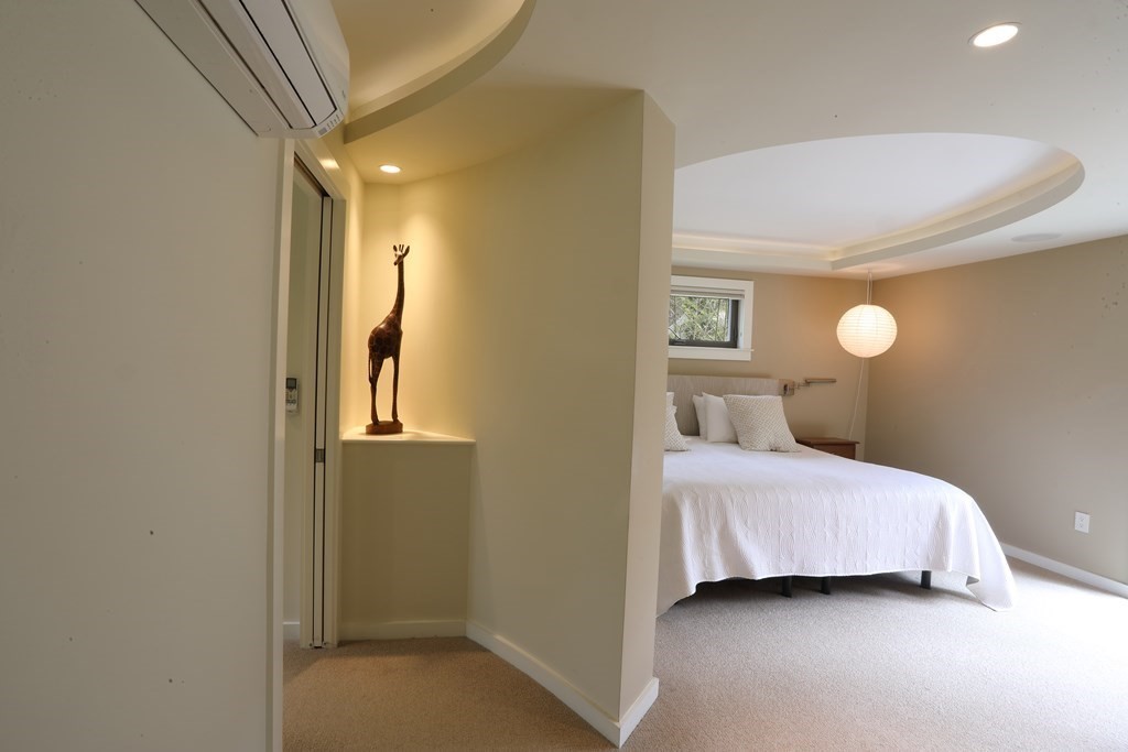 18 Willow Road Harvard, MA 01451 - Photo 10 of 35 a bedroom with a bed and a lamp