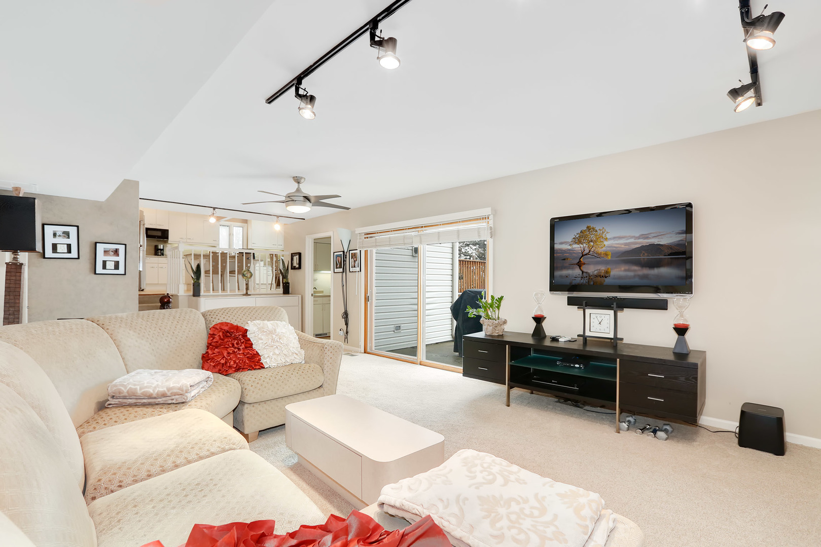 1341 Devonshire Road Buffalo Grove, IL 60089 - Photo 12 of 34 a living room with furniture and a flat screen tv