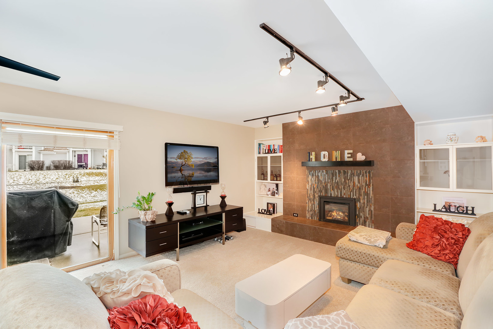 1341 Devonshire Road Buffalo Grove, IL 60089 - Photo 13 of 34 a living room with furniture and a fireplace