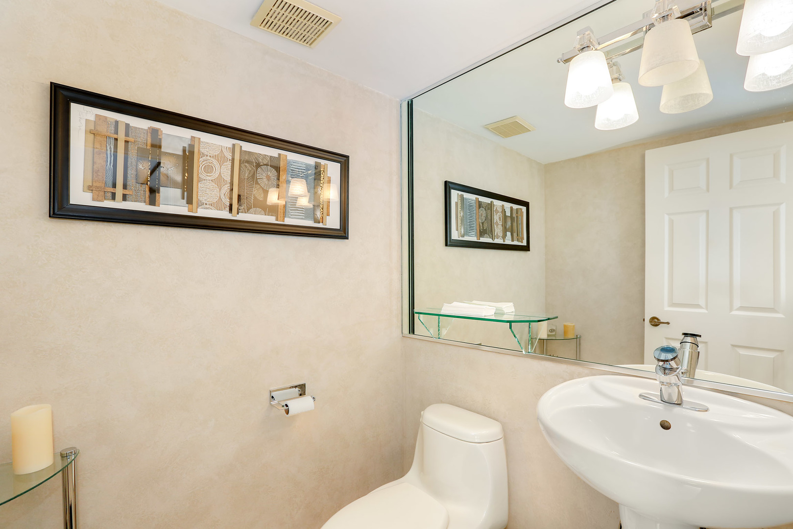 1341 Devonshire Road Buffalo Grove, IL 60089 - Photo 14 of 34 a bathroom with a toilet a sink and mirror