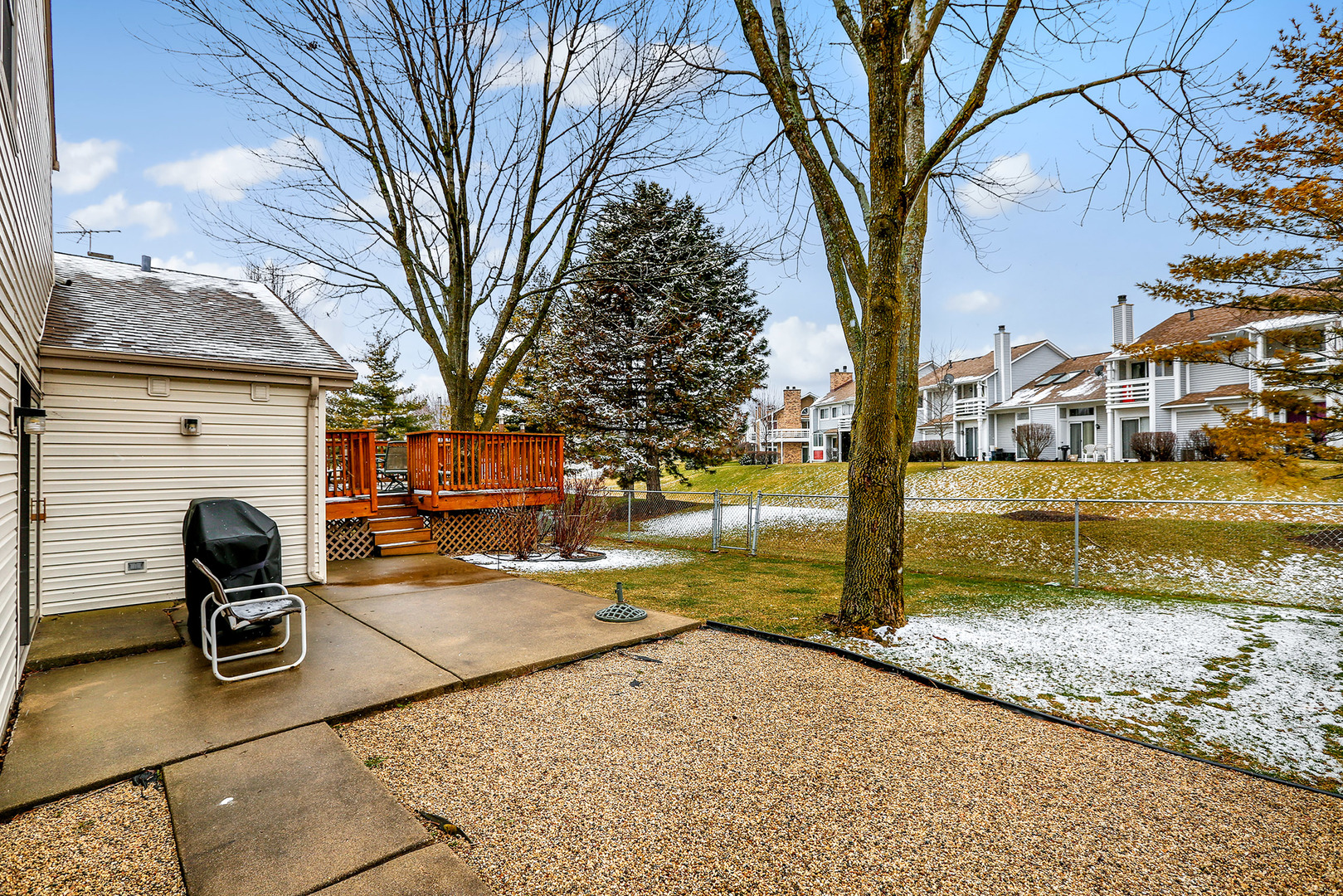 1341 Devonshire Road Buffalo Grove, IL 60089 - Photo 33 of 34 a view of a patio with table and chairs under an umbrella
