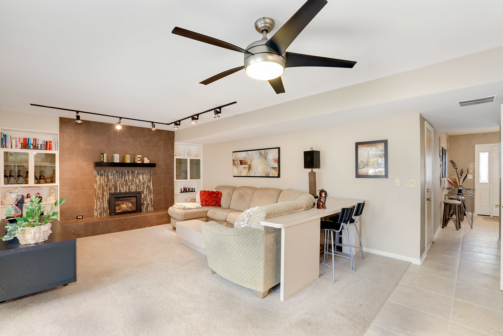 1341 Devonshire Road Buffalo Grove, IL 60089 - Photo 10 of 34 a living room with furniture and a fireplace