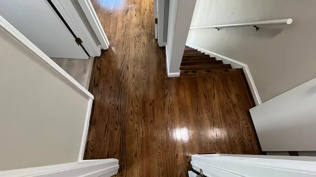 a view of staircase with railing and stairs