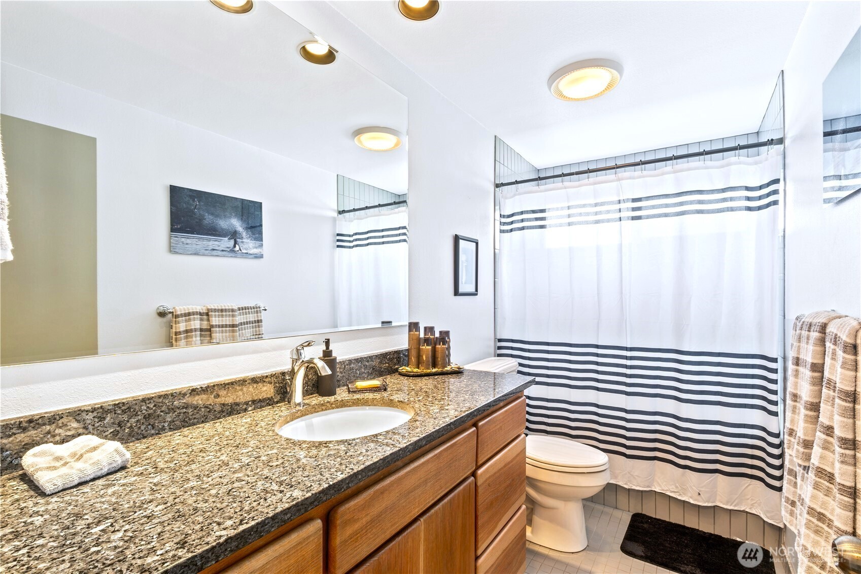 9609 Samish Island Road Bow, WA 98232 - Photo 14 of 33 a bathroom with a granite countertop sink mirror vanity and toilet