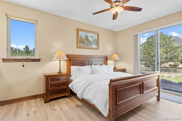 a bedroom with bed and a window