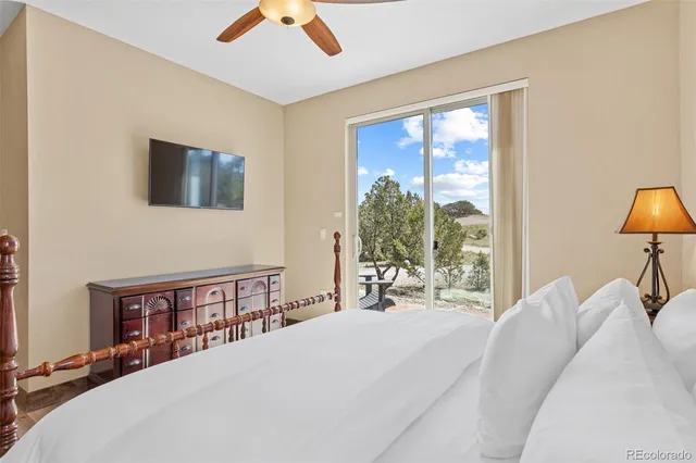 a bed room with a bed and a chair