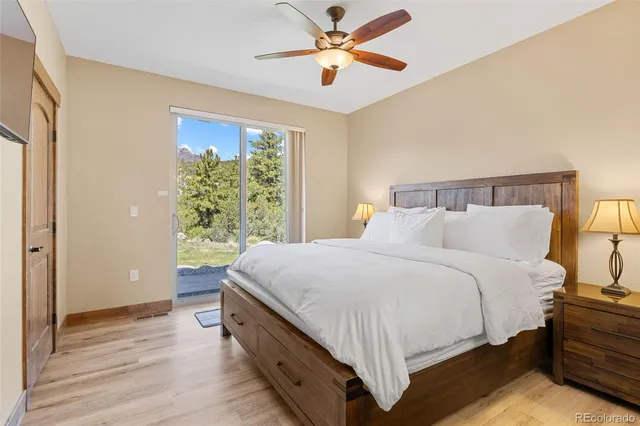 a spacious bedroom with a bed and a window