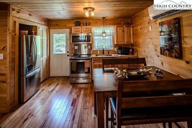 a kitchen with a stove and a refrigerator