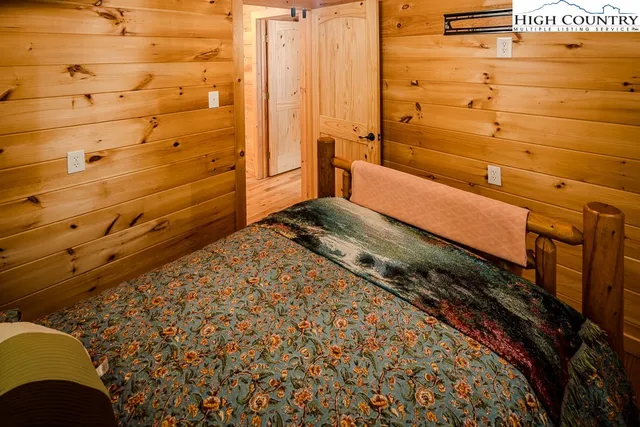 a bed room with a bed and a window