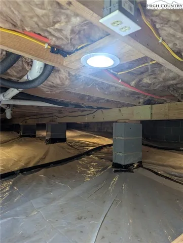 a view of backyard of house with green space