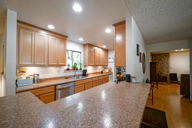 a bedroom with furniture and a flat screen tv