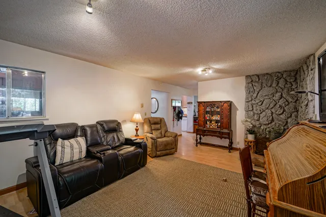 a view of staircase with wooden floor and white walls