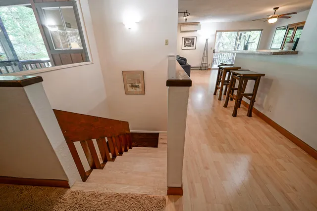 a bedroom with a bed and a mirror