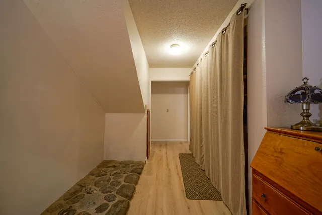 a bedroom with a bed and a chair