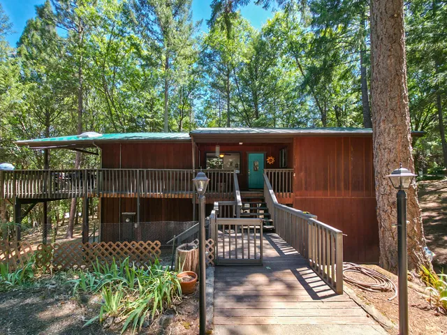 a view of a porch with wooden floor and outdoor space