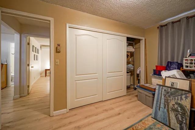 a view of a chair and tables in the balcony