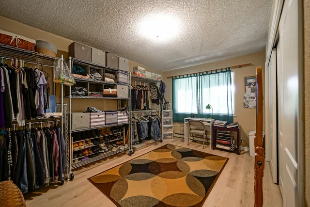 a blue umbrella sitting in front of a house