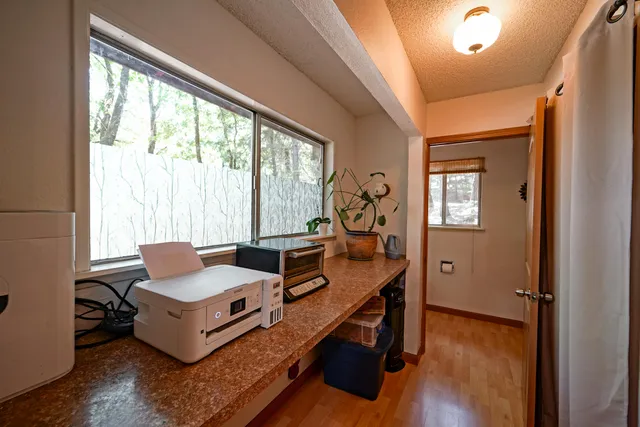 a view of a chair and table in the patio