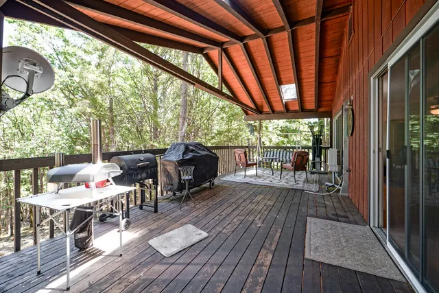 a backyard of a house with outdoor seating