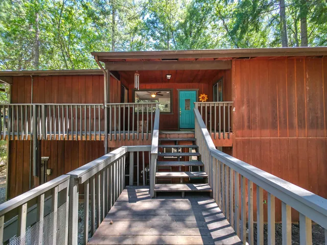 a view of a porch with wooden floor and outdoor space