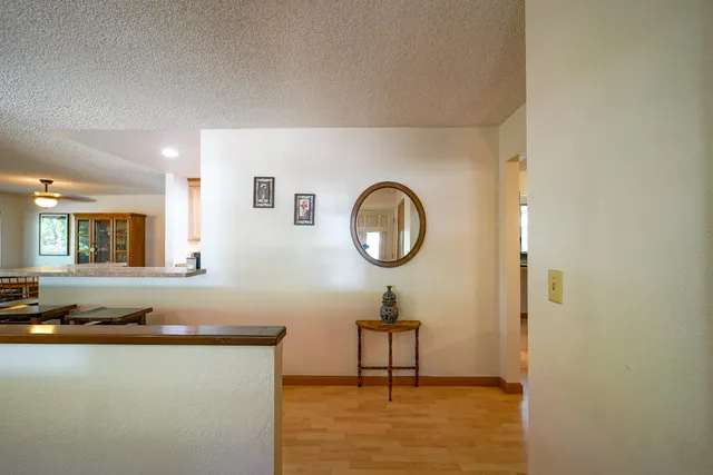 a kitchen with stainless steel appliances granite countertop sink stove and cabinets