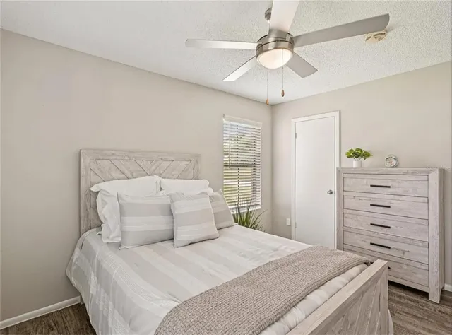 a bedroom with a bed and a dresser