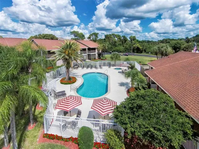 an outdoor space with furniture and garden view