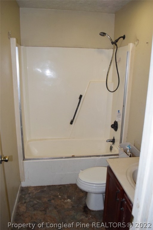 1796 Arrow Ridge Way Fayetteville, NC 28304 - Photo 14 of 15 a bathroom with a granite countertop toilet and a shower