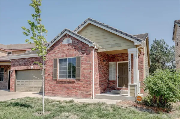 front view of a house with a small yard