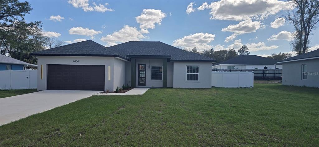 4464 Southwest 132nd Street Ocala, FL 34473 - Photo 1 of 17 a view of a house with a garden
