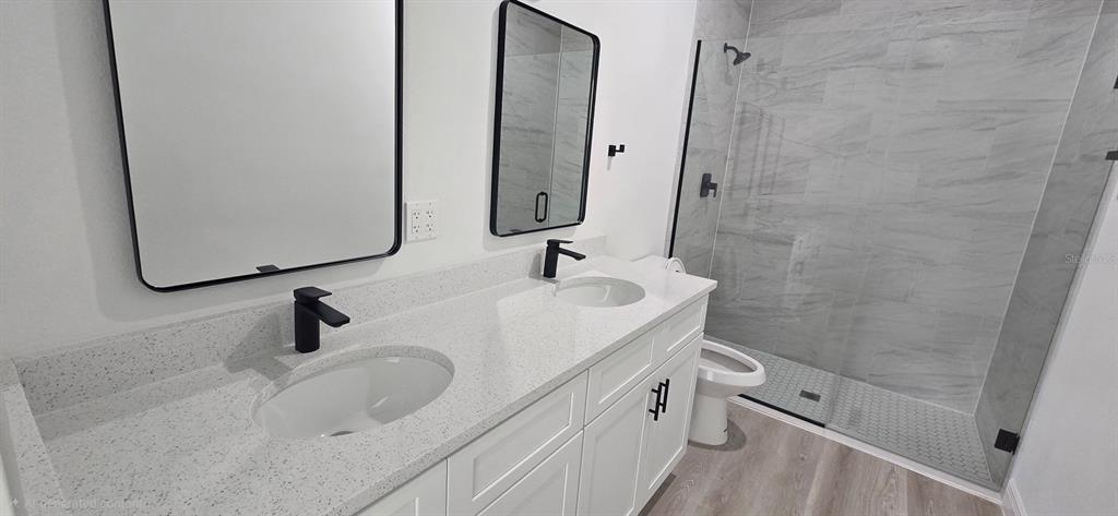 4464 Southwest 132nd Street Ocala, FL 34473 - Photo 13 of 17 a bathroom with a sink and a mirror