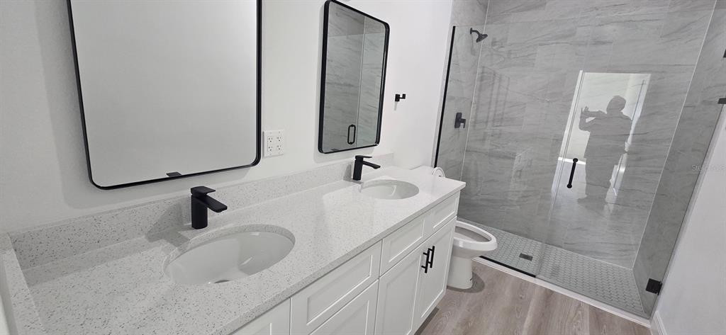 4464 Southwest 132nd Street Ocala, FL 34473 - Photo 14 of 17 a bathroom with a sink and mirror