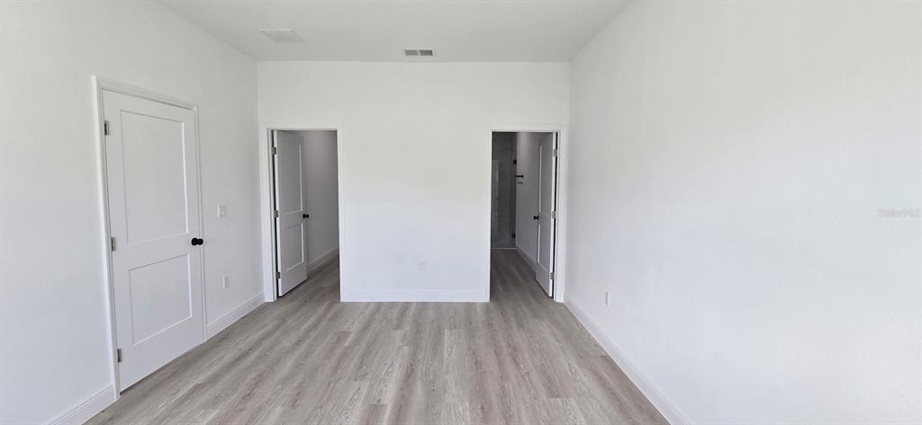 4464 Southwest 132nd Street Ocala, FL 34473 - Photo 15 of 17 a view of a hallway with wooden floor