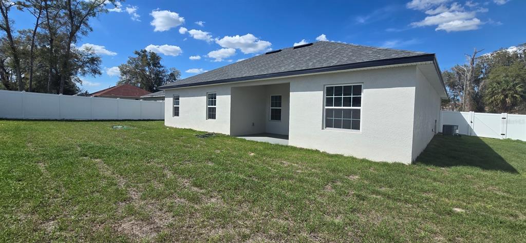 4464 Southwest 132nd Street Ocala, FL 34473 - Photo 17 of 17 a view of a house with a yard