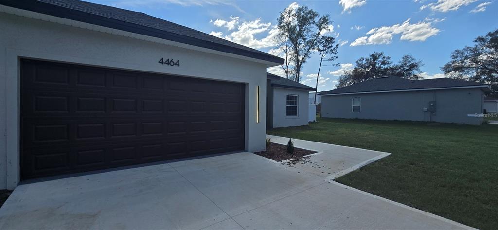 4464 Southwest 132nd Street Ocala, FL 34473 - Photo 2 of 17 a view of a porch with a tree