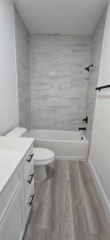 4464 Southwest 132nd Street Ocala, FL 34473 - Photo 9 of 17 a bathroom with a sink a toilet and shower