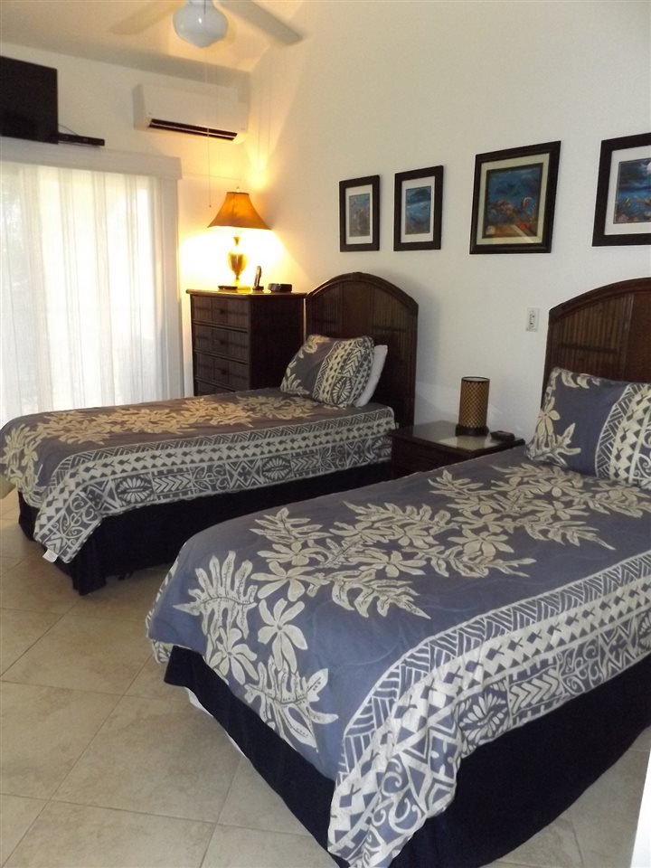 811 South Kihei Road, Unit 5F Kihei, HI 96753 - Photo 13 of 30 a bedroom with a bed couch and window